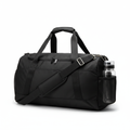 Black gym duffel bag with shoulder strap on white background
