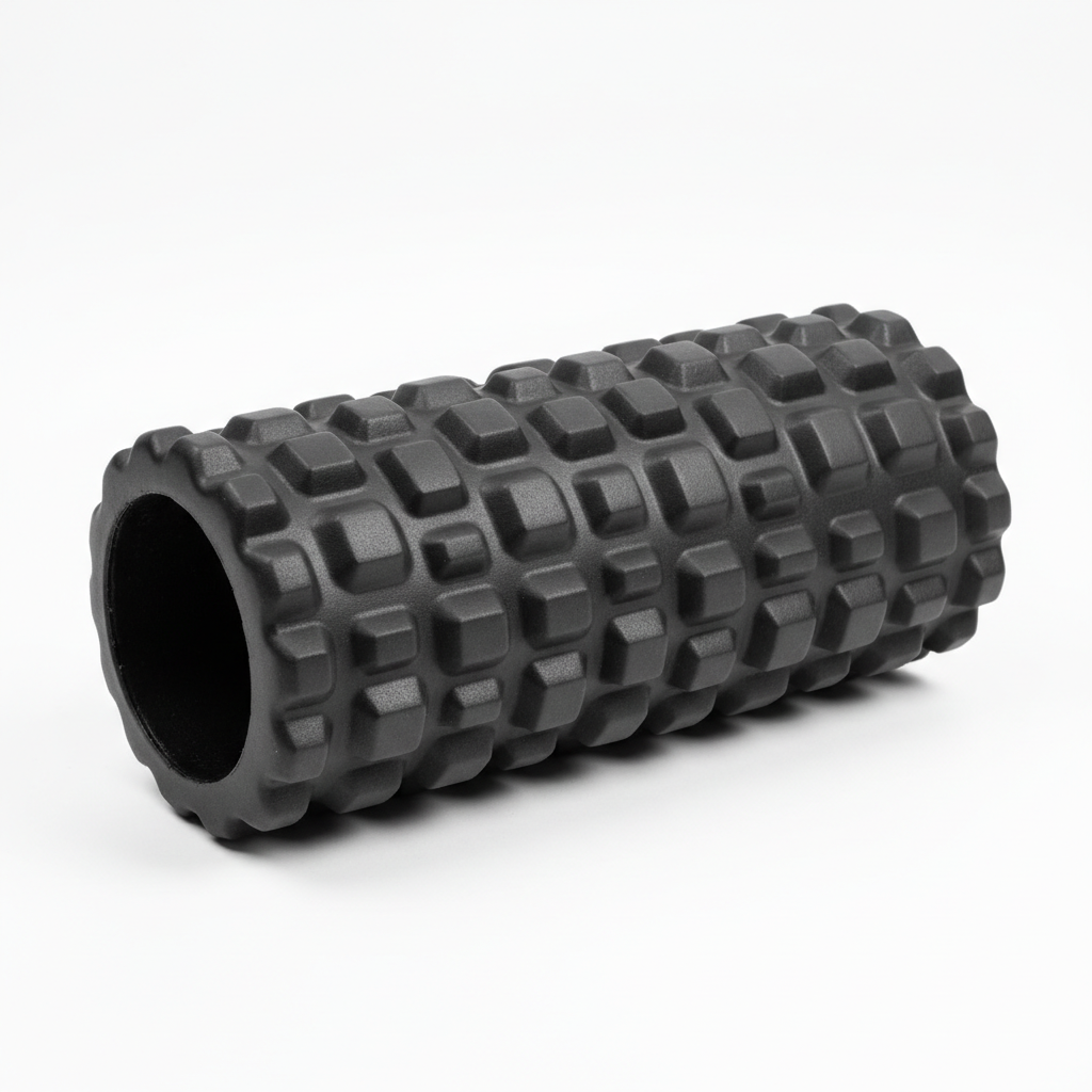 High-density black foam roller on white background
